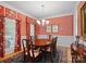 Elegant dining room featuring traditional furniture, decorative window treatments, and warm wall color at 5572 Yorke Nw St, Concord, NC 28027