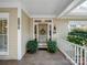 Inviting entryway features a classic front door, decorative wreath, and well-maintained landscaping at 5572 Yorke Nw St, Concord, NC 28027