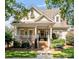 Charming home featuring a welcoming front porch, manicured landscaping, and a classic architectural style at 5572 Yorke Nw St, Concord, NC 28027