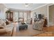 Spacious living room with hardwood flooring, neutral-toned walls, and natural light at 5572 Yorke Nw St, Concord, NC 28027