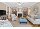 Spacious living room with hardwood flooring, a fireplace, built-in cabinets, and neutral-toned walls at 5572 Yorke Nw St, Concord, NC 28027