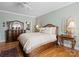 Comfortable bedroom with hardwood flooring, a ceiling fan, natural lighting, and neutral paint at 5572 Yorke Nw St, Concord, NC 28027