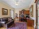 Home office with built-in desk, comfortable seating, and plenty of natural light at 5572 Yorke Nw St, Concord, NC 28027
