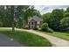 Charming brick home with lush greenery, featuring a curved driveway leading to a welcoming entrance at 61 38Th Nw Ave, Hickory, NC 28601