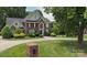 Beautiful brick home with a well-manicured lawn and mature trees offers great curb appeal at 61 38Th Nw Ave, Hickory, NC 28601