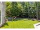 Spacious backyard with manicured lawn and playground, perfect for outdoor activities at 6800 Augustine Way, Charlotte, NC 28270