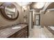 Elegant bathroom features a double vanity with marble countertops and a separate tub at 6800 Augustine Way, Charlotte, NC 28270