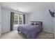 Bedroom featuring a queen bed, and natural light from the window at 6800 Augustine Way, Charlotte, NC 28270