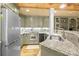Close-up of kitchen featuring granite countertops, stainless steel appliances, and custom cabinetry at 6800 Augustine Way, Charlotte, NC 28270