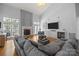 Spacious living room features a fireplace, large sectional sofa, and a television at 6800 Augustine Way, Charlotte, NC 28270