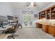 Office with built in shelves, two desks, carpeted floor, and a view of the outdoor patio at 6800 Augustine Way, Charlotte, NC 28270