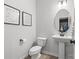 This half bathroom features neutral tones and contemporary fixtures at 7025 Amberhouse Dr, Charlotte, NC 28212