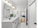 Modern bathroom with double sink vanity, marble floors and granite countertops at 7025 Amberhouse Dr, Charlotte, NC 28212