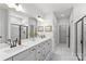 This luxurious bathroom boasts double vanity sinks and a spacious shower at 7025 Amberhouse Dr, Charlotte, NC 28212