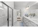 This bathroom features double vanity sinks, granite counters, and a glass shower at 7025 Amberhouse Dr, Charlotte, NC 28212