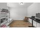 Neutral bedroom staged with a bookshelf and a brown leather chair at 7025 Amberhouse Dr, Charlotte, NC 28212