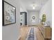 Inviting foyer with wood flooring, a stylish rug, and elegant wall decor at 7025 Amberhouse Dr, Charlotte, NC 28212