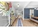 Bright foyer with wood floors, stylish runner rug, and elegant decorative accents at 7025 Amberhouse Dr, Charlotte, NC 28212