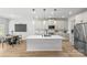 Bright, modern kitchen with a center island, sleek cabinetry, and stainless steel refrigerator at 7025 Amberhouse Dr, Charlotte, NC 28212