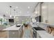 Spacious kitchen boasts a large island, modern appliances, and an open view to the backyard at 7025 Amberhouse Dr, Charlotte, NC 28212