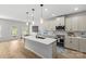 Modern kitchen with a center island, pendant lighting, and stainless steel appliances at 7025 Amberhouse Dr, Charlotte, NC 28212