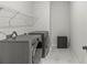 Efficient laundry room with modern washer and dryer, storage space and clean design at 7025 Amberhouse Dr, Charlotte, NC 28212