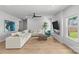 Bright living room with fireplace, hardwood floors, ample seating, and natural light at 7025 Amberhouse Dr, Charlotte, NC 28212