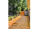 Backyard wooden deck overlooking manicured lawn surrounded by lush greenery at 7215 Wingstone Ln, Charlotte, NC 28262