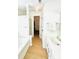 Well-lit bathroom with a single sink vanity, and walk-in closet at 7215 Wingstone Ln, Charlotte, NC 28262