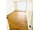 Bright bedroom with light wood flooring and natural light streaming through the window at 7215 Wingstone Ln, Charlotte, NC 28262
