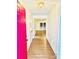 Bright entryway with wood floors, fresh paint, and views into the open living space at 7215 Wingstone Ln, Charlotte, NC 28262