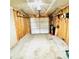 An empty single-car garage with unfinished walls and concrete flooring at 7215 Wingstone Ln, Charlotte, NC 28262