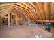 Unfinished attic space with exposed wooden beams and utilities at 7731 Sedgebrook E Dr, Stanley, NC 28164