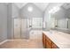 Bright bathroom featuring a double sink vanity, soaking tub, and separate shower at 7731 Sedgebrook E Dr, Stanley, NC 28164