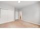 Carpeted bedroom with natural light, closet access, and neutral wall color at 7731 Sedgebrook E Dr, Stanley, NC 28164