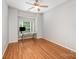 Bedroom with wood floors and a window, perfect for a home office or guest room at 7731 Sedgebrook E Dr, Stanley, NC 28164