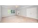 Bright bedroom features neutral carpet, a large window and double closets at 7731 Sedgebrook E Dr, Stanley, NC 28164