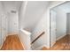 Hallway featuring wood floors, neutral walls, and access to various rooms with doorways at 7731 Sedgebrook E Dr, Stanley, NC 28164