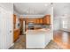 Bright kitchen features stainless steel appliances and cabinetry with a pass-through to the living room at 7731 Sedgebrook E Dr, Stanley, NC 28164