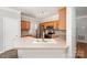 This well-lit kitchen features stainless steel appliances, light countertops, and wood cabinets at 7731 Sedgebrook E Dr, Stanley, NC 28164
