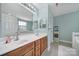 Bright bathroom featuring a double sink vanity and large mirror at 918 Kite Dr, Fort Mill, SC 29715