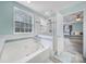 A bright bathroom featuring a soaking tub and glass shower at 918 Kite Dr, Fort Mill, SC 29715