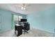 Bedroom featuring gray carpet, blue walls, desk and fan at 918 Kite Dr, Fort Mill, SC 29715