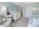 A peaceful bedroom with a crib, comfortable seating, and plenty of natural light at 918 Kite Dr, Fort Mill, SC 29715