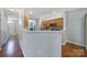 Open kitchen featuring stainless steel appliances, wood cabinets, and a breakfast bar with view to front door at 918 Kite Dr, Fort Mill, SC 29715