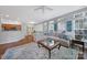Open-concept living room with hardwood floors and plenty of space for entertaining at 918 Kite Dr, Fort Mill, SC 29715