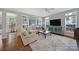 Bright living room with hardwood floors, many windows, and comfortable seating at 918 Kite Dr, Fort Mill, SC 29715