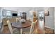 Open-concept design with hardwood floors, connecting the living room and dining area at 918 Kite Dr, Fort Mill, SC 29715