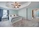 A calming main bedroom with a tray ceiling, soft carpet, and soothing paint at 918 Kite Dr, Fort Mill, SC 29715