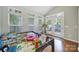 Bright playroom with hardwood floors, natural light, vaulted ceiling, and access to a patio at 918 Kite Dr, Fort Mill, SC 29715